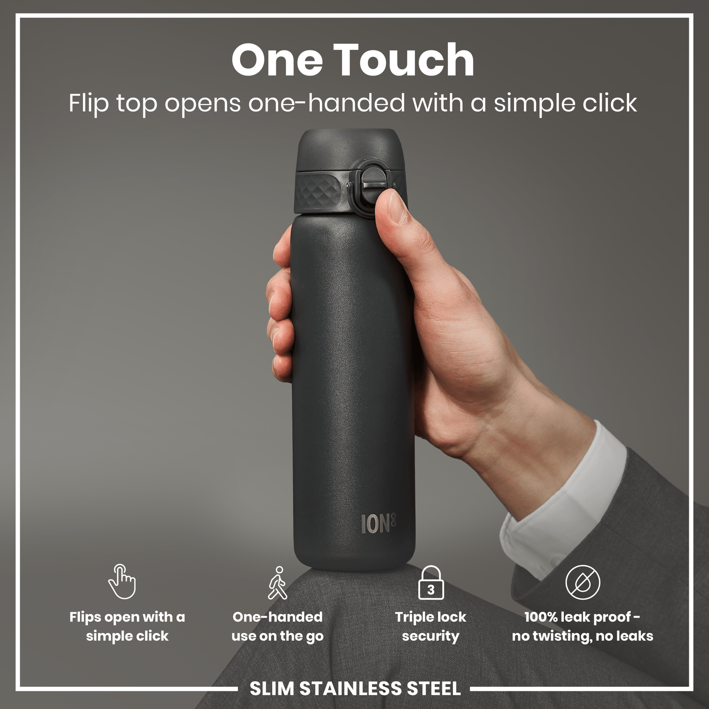 A dark-grey, slim stainless steel water bottle is being held and opened one-handed. The flip top opens with a simple click; the bottle offers triple lock security and is 100% leak proof.