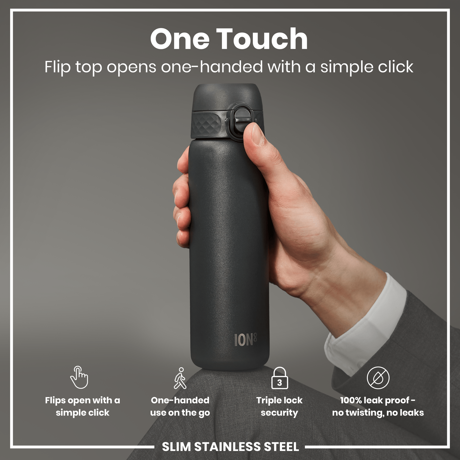 A dark-grey, slim stainless steel water bottle is being held and opened one-handed. The flip top opens with a simple click; the bottle offers triple lock security and is 100% leak proof.