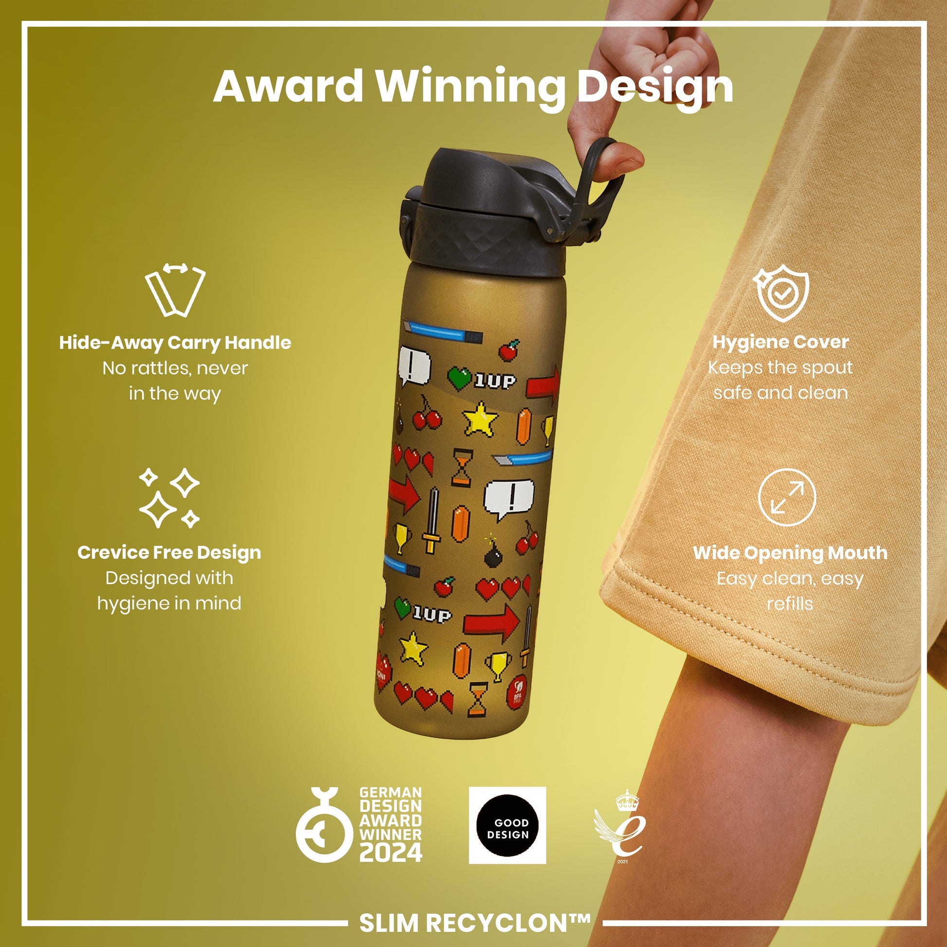 A gold water bottle, with a retro-game design, is being held. The bottle features a hide-away handle, hygiene cover, and wide mouth. It's an award-winning design.