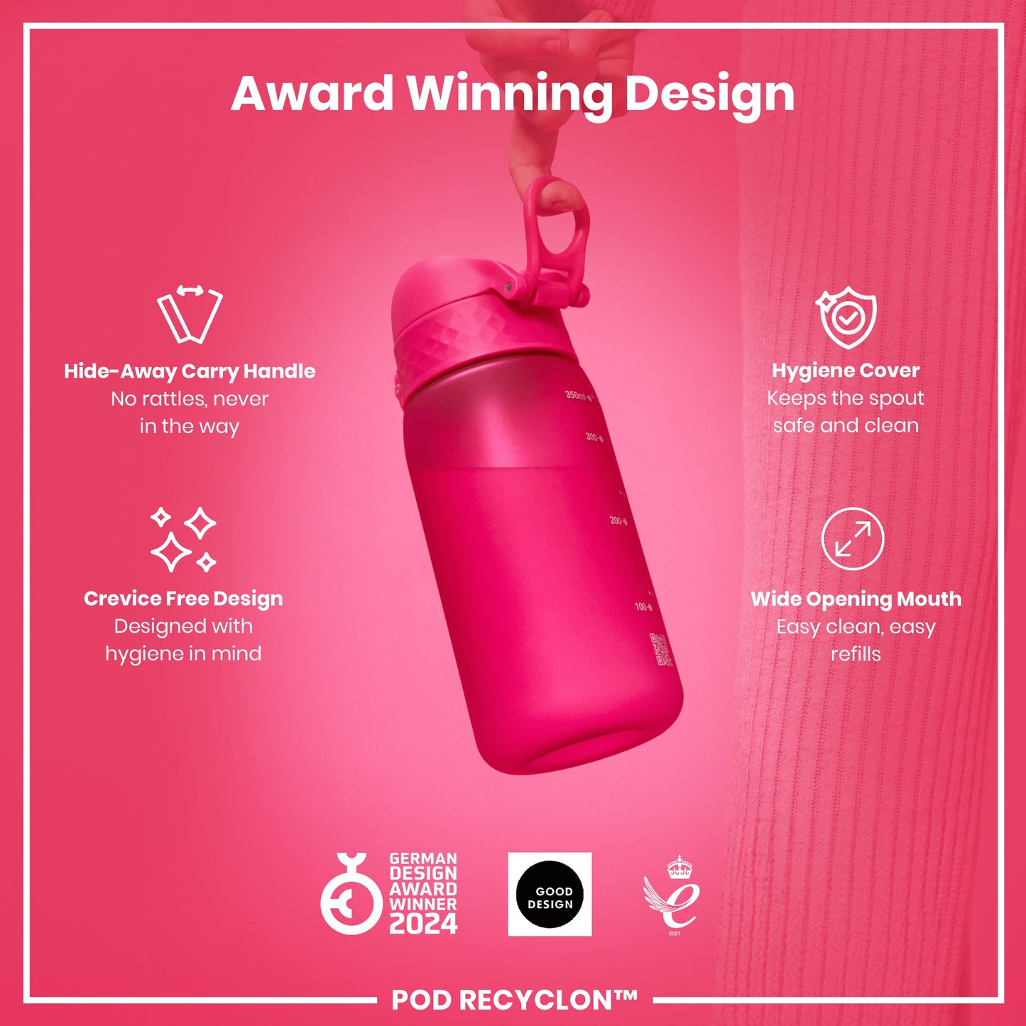 A pink water bottle is being held. Its features include a hide-away handle, crevice-free design, hygiene cover, and wide mouth. It's an award-winning design.