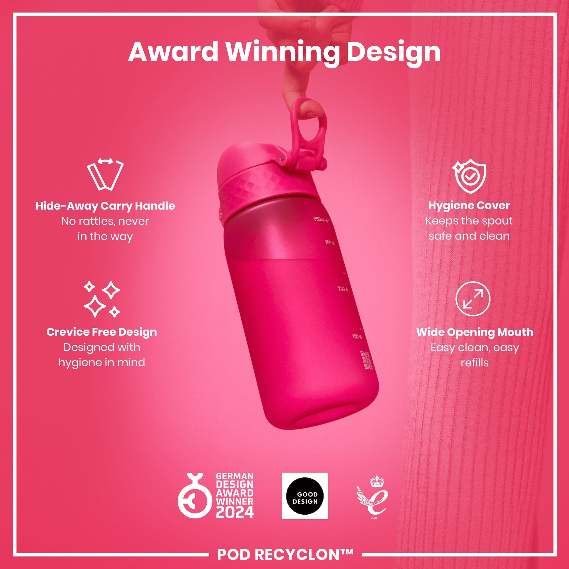 A pink water bottle is being held. Its features include a hide-away handle, crevice-free design, hygiene cover, and wide mouth. It's an award-winning design.