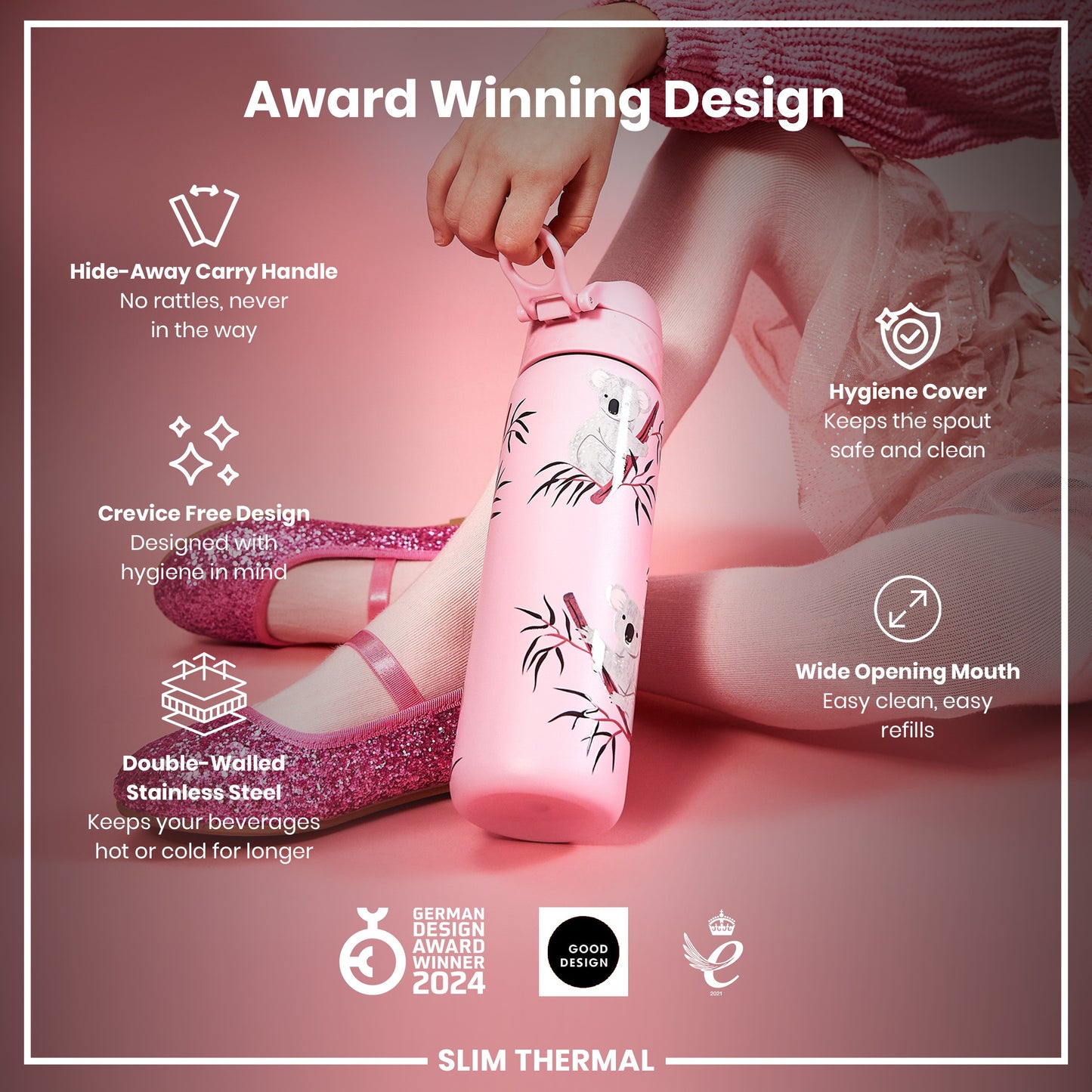 A pink, koala-patterned water bottle is held by a child. It features a hide-away handle, crevice-free design, and wide mouth. The bottle is double-walled stainless steel and an award winner.
