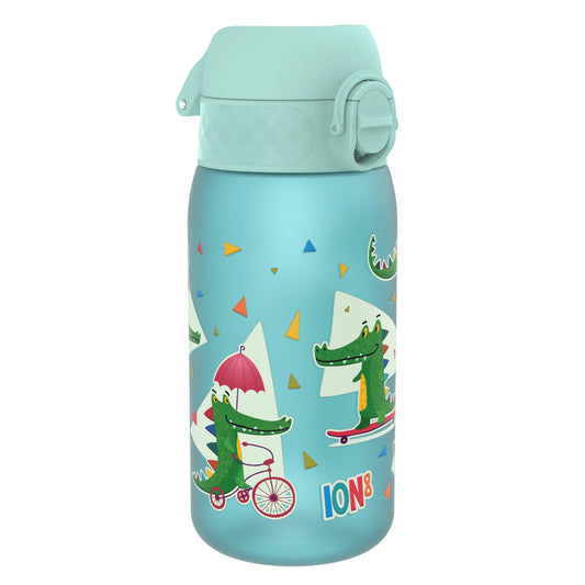 A light-blue water bottle, featuring cartoon crocodiles on bicycles and skateboards, sits on a white background. The bottle is capped and says "ION8".
