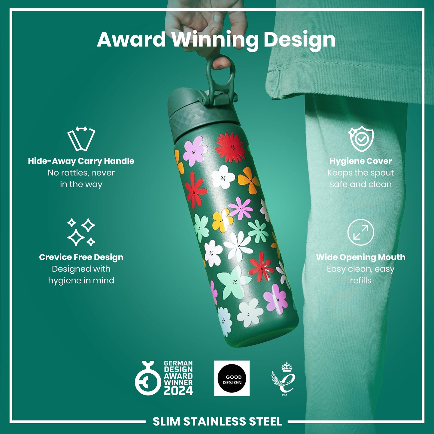 A slim stainless steel water bottle, being held, features a floral design. It has a hide-away handle, crevice-free design, hygiene cover, and wide opening mouth. The bottle is an award-winning design.