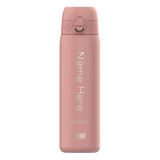 A pink thermos flask stands upright displaying the text 