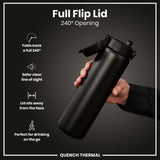 A black water bottle with a flip lid is being held; the lid is open to 240 degrees, showing its features. The bottle is displayed against a dark background. Full Flip Lid 240° Opening. QUENCH THERMAL.