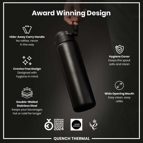 A black, double-walled stainless steel water bottle is being held; it features a hide-away handle, wide mouth, and hygiene cover. The bottle is shown against a dark background, and boasts several design awards.