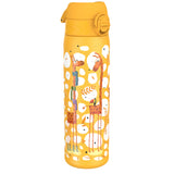 A yellow water bottle, featuring cartoon giraffes and other designs, stands upright against a white background.