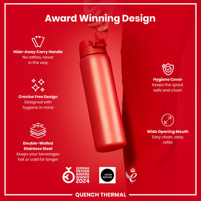 A red, double-walled stainless steel water bottle is being held. It features a hide-away handle, crevice-free design, hygiene cover, and wide mouth. The bottle is an award-winning design.