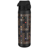 A black water bottle, featuring a pixelated video game maze design, stands against a white background. The design includes points and game characters.
