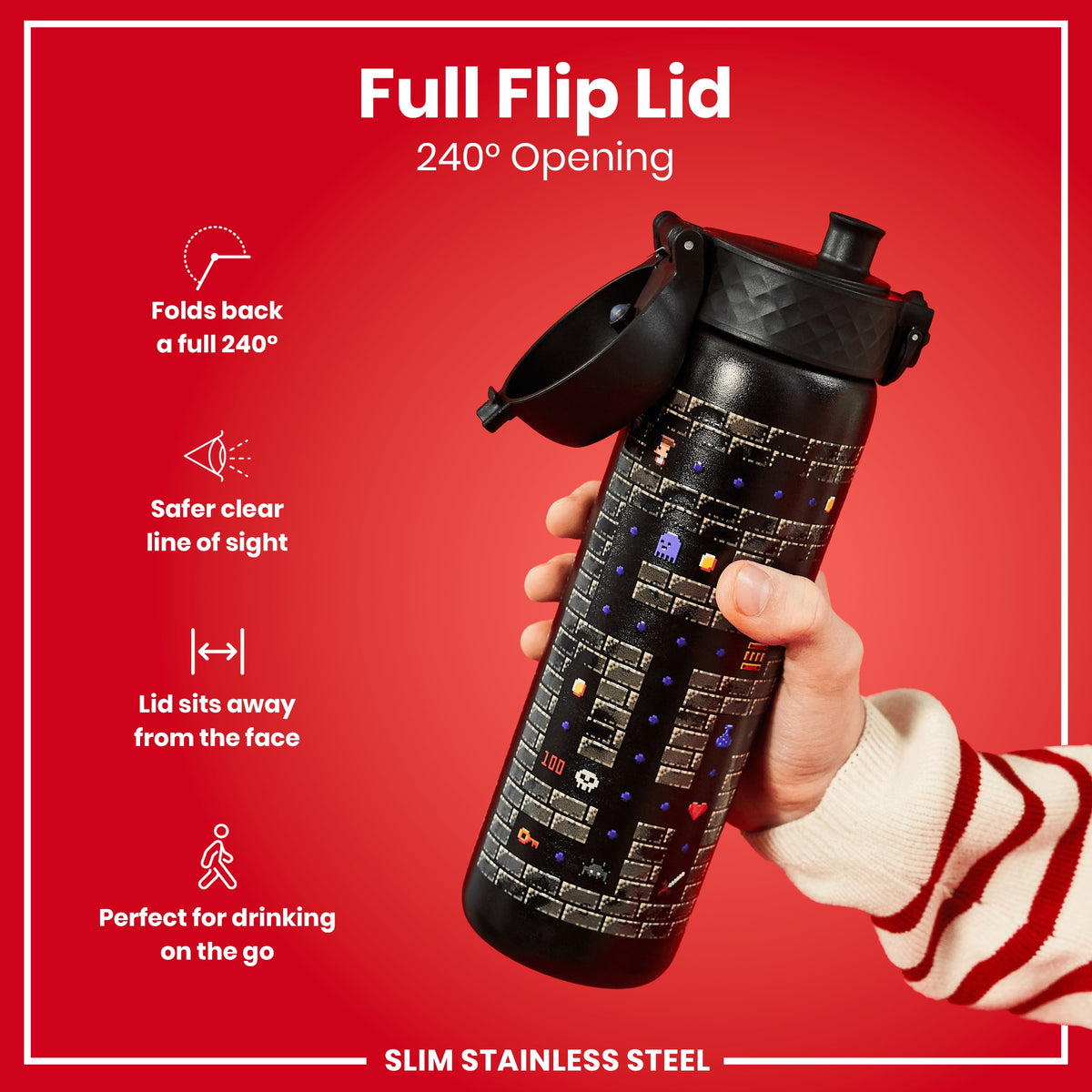 A hand holds a slim stainless steel water bottle with a full flip lid; the lid opens 240 degrees. The bottle features a retro video game design.
