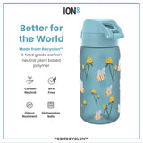 A blue water bottle, featuring a bee and flower design, sits against a white background. It is made from a plant-based polymer and is described as 