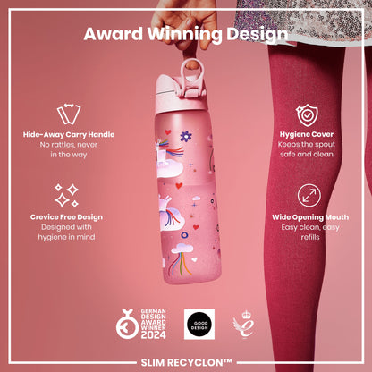 A pink water bottle with a unicorn design is being held. It features a hide-away handle, crevice-free design, hygiene cover, and wide mouth. Awards include German Design Award Winner 2024 and Good Design.