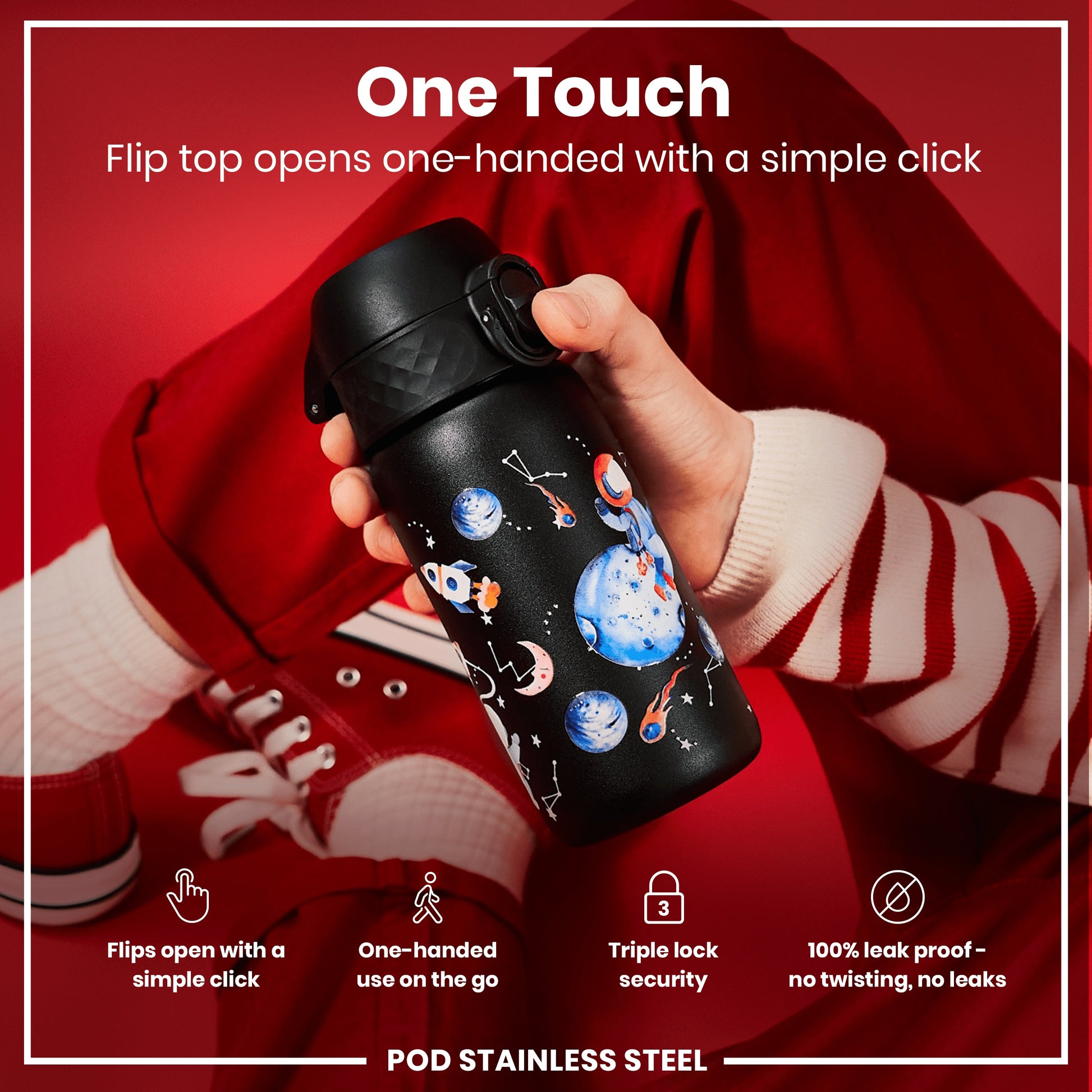 A black, space-themed water bottle with a flip top is being held. The flip top opens one-handed with a simple click. The bottle is shown against a red background.