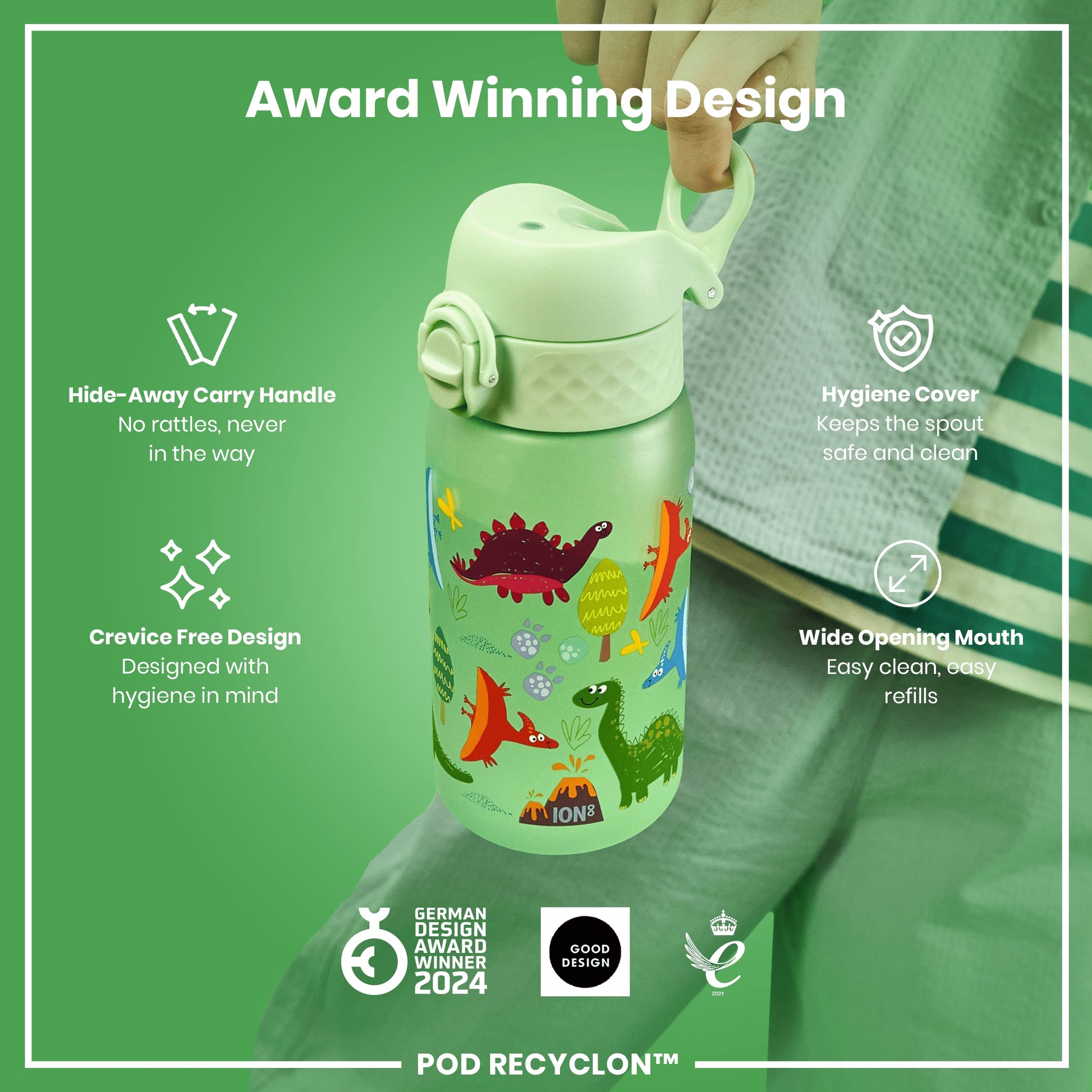 A light-green water bottle, featuring a dinosaur design, is being held. The bottle has a hide-away handle, hygiene cover, and wide opening mouth. It's an award-winning design.