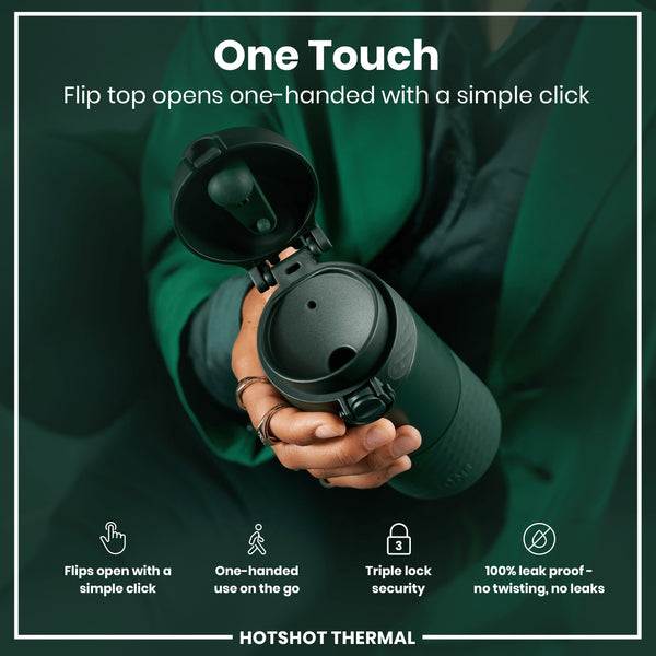 A dark-green thermos, with its flip top open, is held in a person's hand. The top opens one-handed with a click. The background is a dark-green fabric. “One Touch,” “Flips open with a simple click,” “One-handed use on the go,” “Triple lock security,” “100% leak proof - no twisting, no leaks,” and “HOTSHOT THERMAL” are also present.