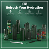 Several dark-green water bottles, some with child-friendly designs, are displayed on a green surface; 