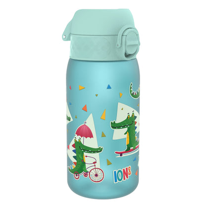 A light-blue water bottle, featuring cartoon crocodiles on bicycles and skateboards, sits on a white background. The bottle is capped and says "ION8".