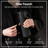 A black water bottle, being held, has a flip top that opens one-handed. The bottle features a triple lock security mechanism and is leak-proof. The context is a person wearing a black blazer.