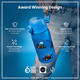 A blue water bottle, featuring playful cat illustrations, is being held. Its design includes a hide-away handle, hygiene cover, and wide mouth for easy cleaning and refills. It's an award-winning design.
