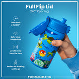 A blue, child-sized water bottle with a full flip lid and undersea creature print is held by a hand; the lid folds back 240 degrees. The bottle is designed for on-the-go use. It's made of stainless steel.