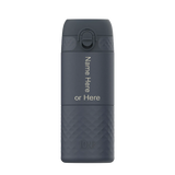 A dark gray water bottle stands upright featuring an easy-access lid Text displayed vertically says Name Here or Here The brand Ion8 is embossed at the bottom