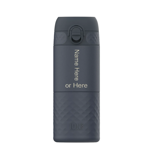 A dark gray water bottle stands upright featuring an easy-access lid Text displayed vertically says Name Here or Here The brand Ion8 is embossed at the bottom