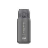 A gray water bottle stands upright with a flip-top lid against a plain background. Text reads: 