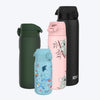 Four insulated water bottles, varying in size and color, stand upright against a plain white background. One is dark green, another light pink with a koala design, a smaller light blue one features cartoon sea creatures, and a tall black one is shown.